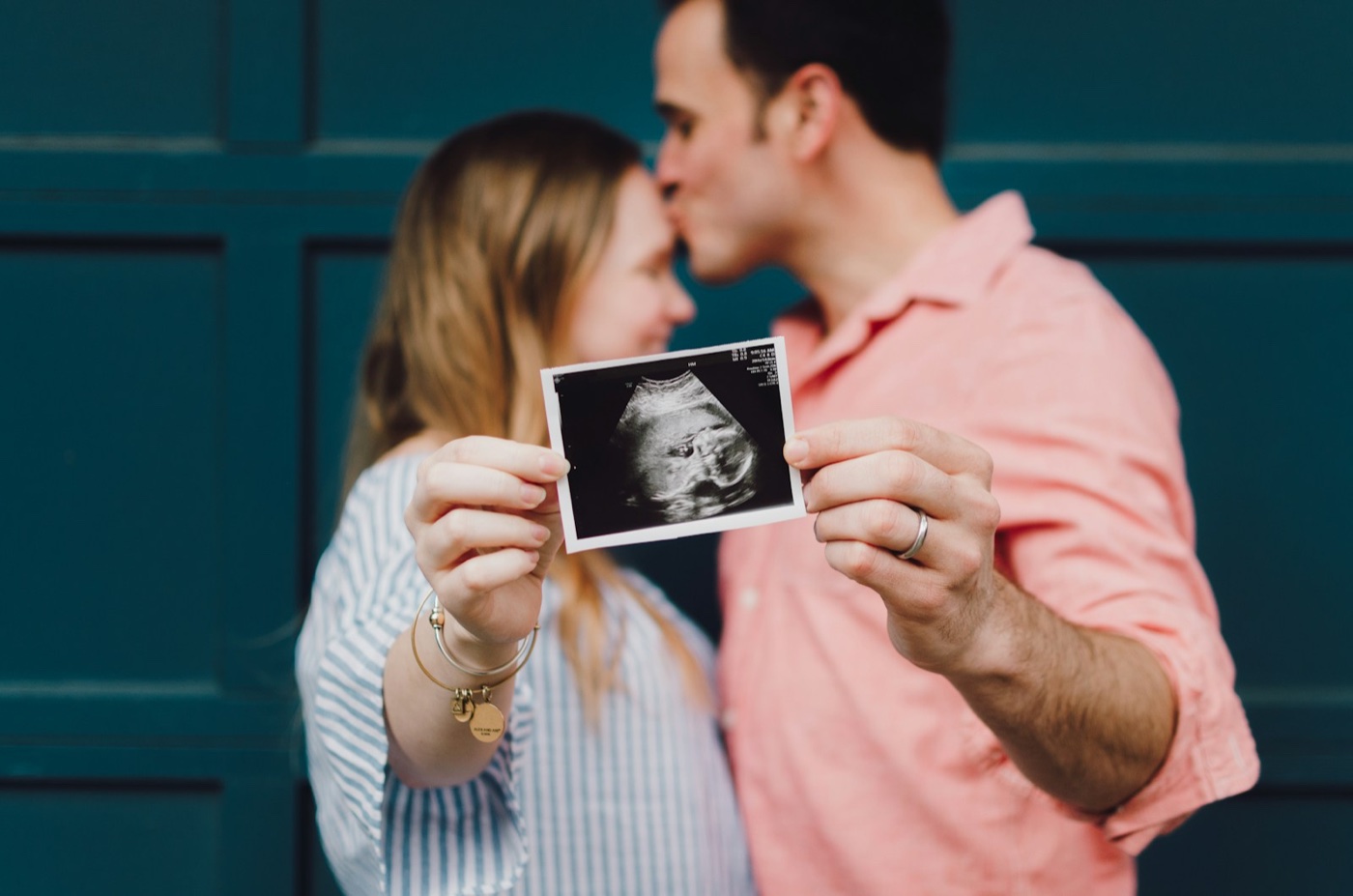 Expecting parents preparing for twin pregnancy